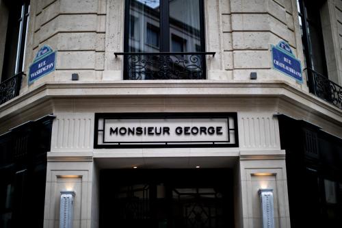 a sign on the front of a museum garage at Monsieur George Hotel & Spa - Champs-Elysées in Paris