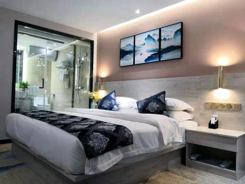 Postel nebo postele na pokoji v ubytování Demei Boutique Hotel