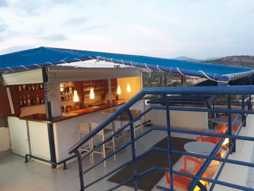 a deck of a ship with a bar on it at Heliotopos Apartments in Tolo