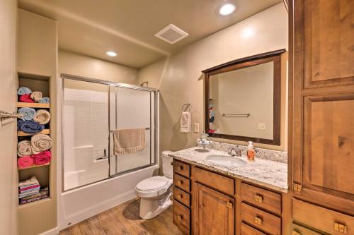 a bathroom with a sink and a shower and a toilet at 1 Mi to Rainbow Lake Newly Built and Woodsy Retreat in Lake of the Woods