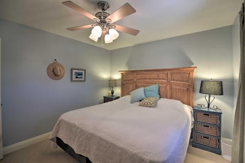 a bedroom with a bed and a ceiling fan at Fish at Canalfront Bay St Louis Home - Dock and Deck in Shoreline Park