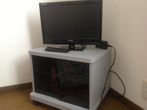 西山高原プチホテル恋泉Koizumiにあるテレビまたはエンターテインメントセンター