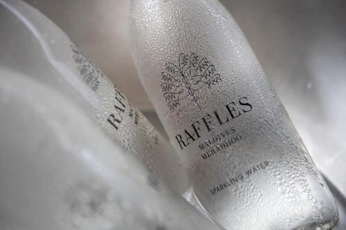 a close up of a bottle of wine at Raffles Maldives Meradhoo in Gaafu Alifu Atoll
