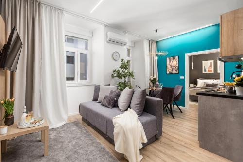 a living room with a couch and a dining room at Saint Vitus Apartments with balcony in Rijeka