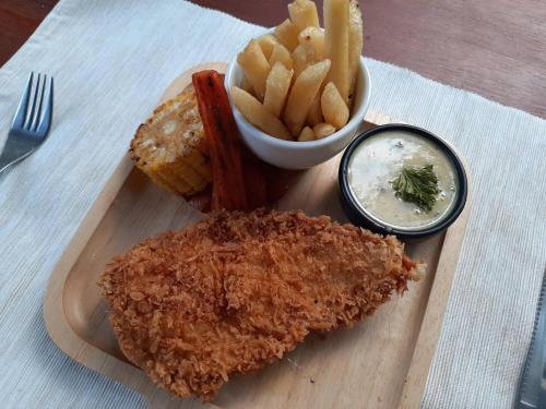 a plate of fried chicken and french fries and dip at Escape Life Koh Kood in Ko Kood