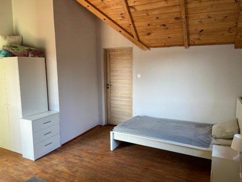 Postel nebo postele na pokoji v ubytování Willa Chańcza