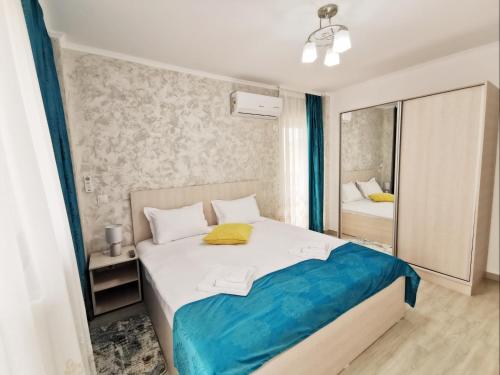 Ένα ή περισσότερα κρεβάτια σε δωμάτιο στο Otopeni Comfort Apartaments