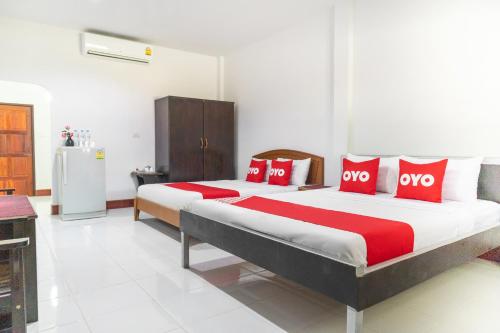 Krevet ili kreveti u jedinici u okviru objekta OYO 627 Sai Thai Garden Home Travel