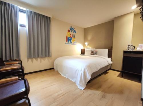 Postel nebo postele na pokoji v ubytování Just Live Inn-Keelung