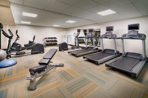 a gym with treadmills and elliptical machines at Holiday Inn Express Boston by IHG in Boston