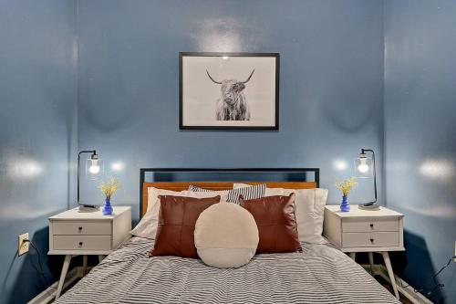 a blue bedroom with a bed with a bull on the wall at 1433 Fletcher Ave,Indianapolis in Indianapolis