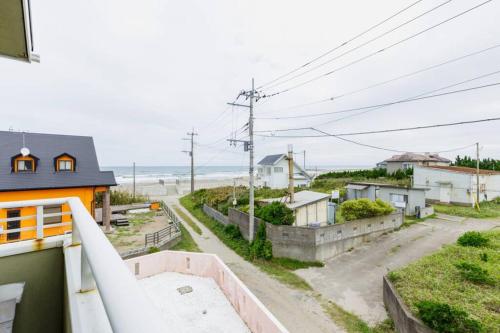 a view from the balcony of a house at Beach House Villa Kashima in Kashima
