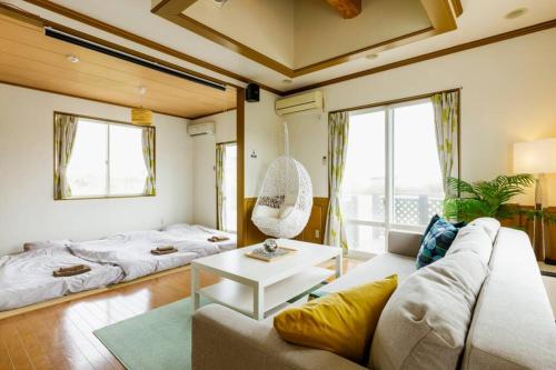 Krevet ili kreveti u jedinici u okviru objekta Beach House Villa Kashima