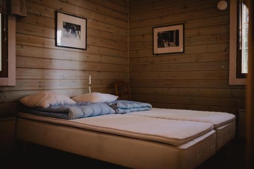 Un pat sau paturi într-o cameră la Wanha Karhunmäki