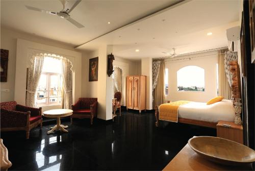 Giường trong phòng chung tại Bloom Boutique l Lake Pichola