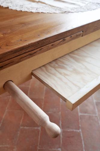 a wooden table with two wooden legs on top of a table at Podere di Moiata in Campestri
