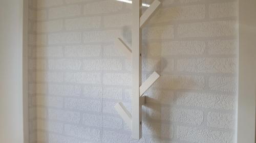 a staircase in a room with a brick wall at SJÖTORPS HOSTEL in Sjötorp