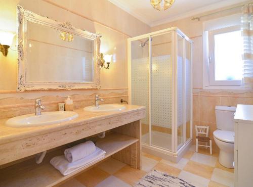 a bathroom with a sink and a shower and a toilet at Villa Cometa - Plusholidays in Calpe