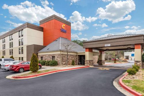 a hotel with a parking lot in front of a building at Comfort Inn & Suites Clemson - University Area in Clemson