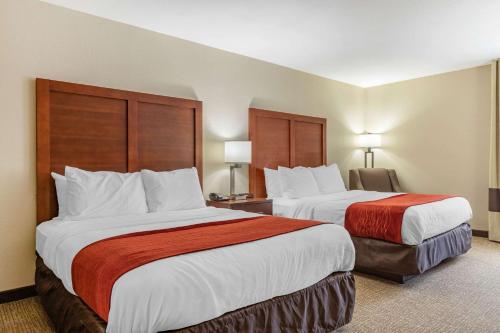 a hotel room with two beds and two lamps at Comfort Inn & Suites Clemson - University Area in Clemson