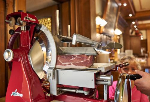 a person taking a picture of a meat machine at Hotel Engel - Familotel Hochschwarzwald in Todtnauberg