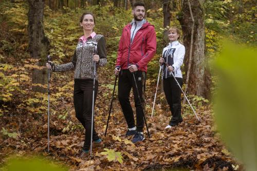 a group of three people on a trail in the woods at Bristol Vila Tereza in Karlovy Vary