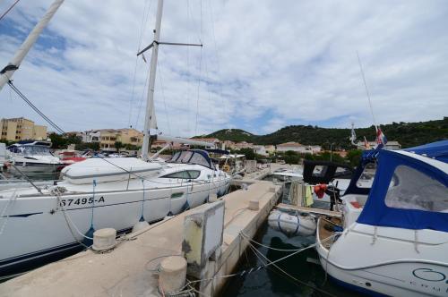 a group of boats docked in a harbor at Apartments Aco in Barbat na Rabu