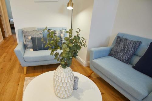 a vase sitting on a table in a living room at Host & Stay - The Old Sweet Shop in Whitby