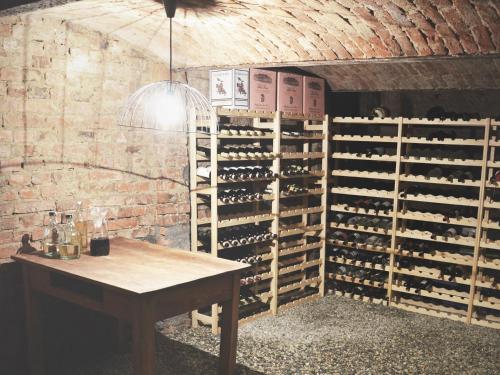 a wine cellar with a wall of wine bottles at Villa Antiqua in Racibórz