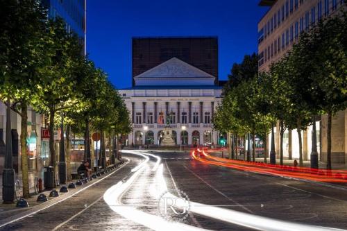 a city street with a building in the background at Studio des jardins suspendus in Liège