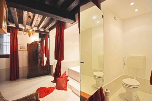 two pictures of a bathroom with a toilet and a sink at Zattere Cottage close to Guggenheim in Venice