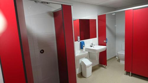 a bathroom with a white toilet and a sink at Zendoira in Palas de Rei 