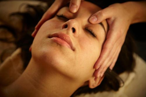 a woman with her hands on her face at Sport Hotel Village in Soldeu
