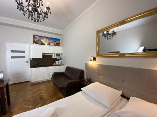 Posteľ alebo postele v izbe v ubytovaní P&J Apartamenty Św. Krzyża