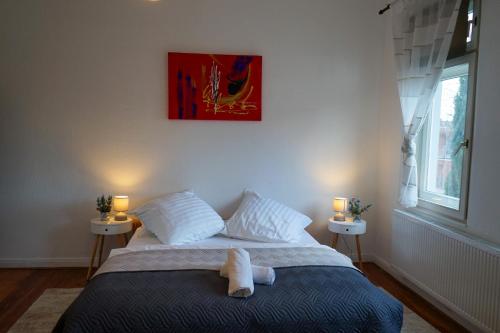 a bedroom with a bed with a stuffed animal on it at Wohnung in Lüneburg in Lüneburg
