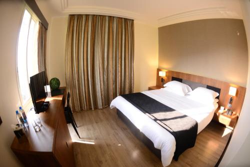 Кровать или кровати в номере Lamunia Hotel