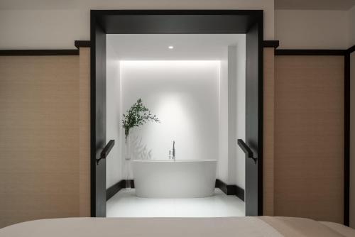 a bathroom with a bath tub in a room at Four Seasons Hotel Montreal in Montréal