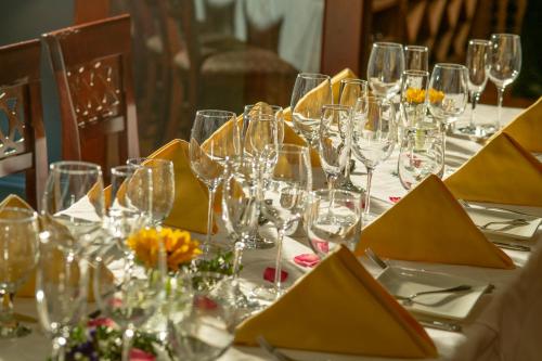 a table with wine glasses and flowers on it at The Inn at Thorn Hill in Jackson