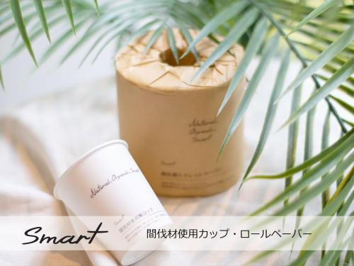 a drink in a cup next to a plant at Super Hotel Mitazono Sendai Airport in Natori