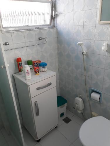 a bathroom with a shower and a sink and a toilet at Recanto Santista in Santos