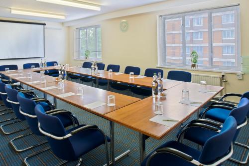 a conference room with a long table and chairs at Holiday Inn Washington by IHG in Washington