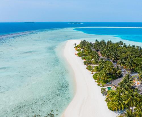 an aerial view of a beach in the maldives at Angsana Velavaru In-Ocean Villas in Dhaalu Atoll