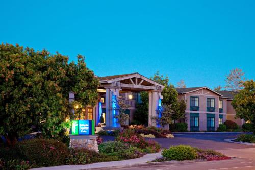 a house with a sign in front of it at Holiday Inn Express & Suites Carpinteria by IHG in Carpinteria