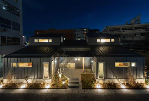 a house in the city at night at Kamome Jyuku in Takamatsu