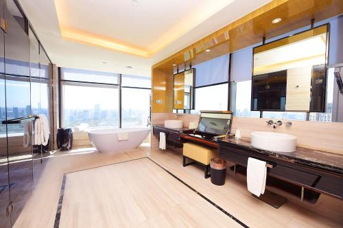 TV a/nebo společenská místnost v ubytování Tangla Hotel Tianjin