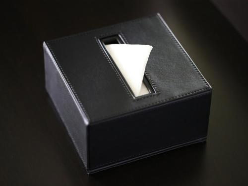 a black box with a white candle in it at APA Hotel Nihombashi Bakuroyokoyama Ekimae in Tokyo