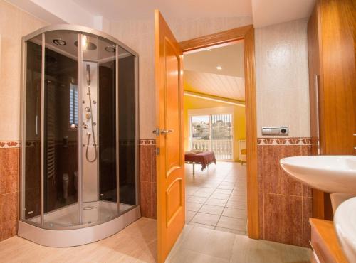 a bathroom with a shower and a sink at Villa Calypso - Plusholidays in Calpe