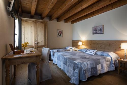 Postel nebo postele na pokoji v ubytování Agriturismo Noiari