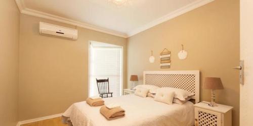 Ένα ή περισσότερα κρεβάτια σε δωμάτιο στο Sea View 18