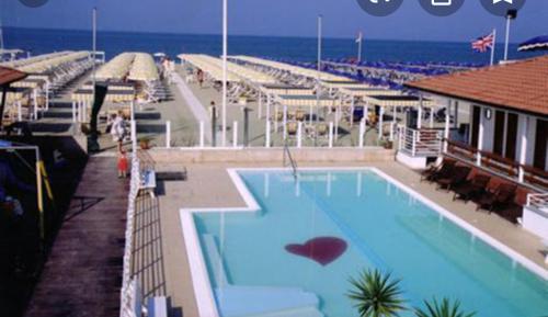 a swimming pool on top of a cruise ship at Enjoy in Viareggio